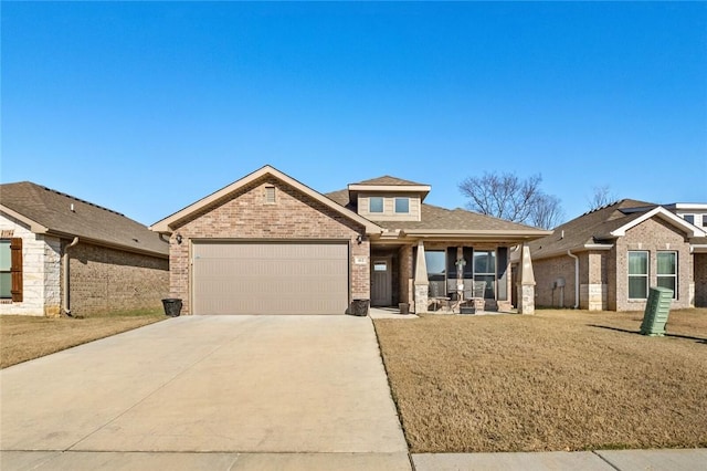 view of front of house with a front yard and a garage