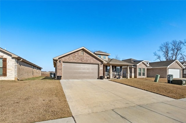 single story home featuring a garage and a front lawn