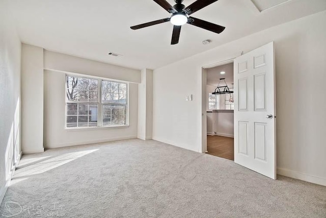 5 S Pollard Ave, Fayetteville, AR 72701 - unfurnished bedroom with carpet flooring, multiple windows, baseboards, and ceiling fan