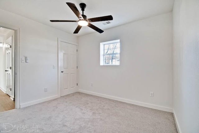 5 S Pollard Ave, Fayetteville, AR 72701 - unfurnished bedroom featuring light carpet, baseboards, and a ceiling fan