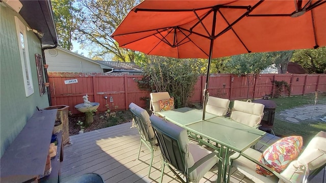 wooden deck with grilling area