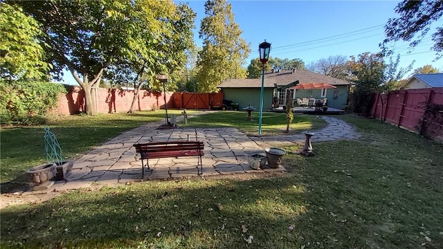 view of yard with a patio area