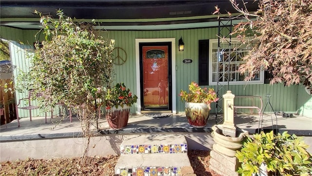 doorway to property featuring covered porch