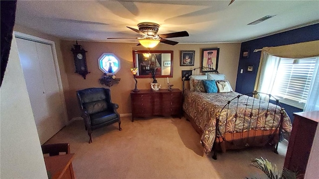 carpeted bedroom with ceiling fan