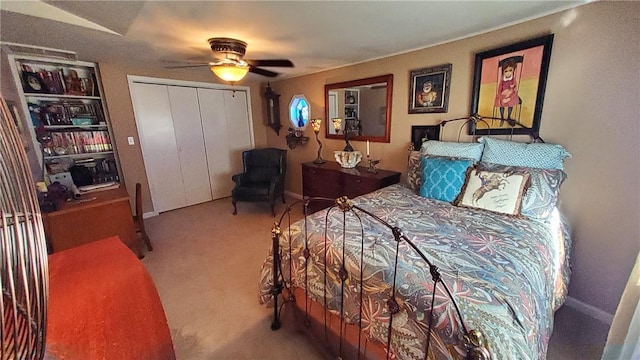 bedroom featuring ceiling fan, carpet floors, and a closet