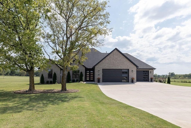 view of front facade featuring a front yard and a garage