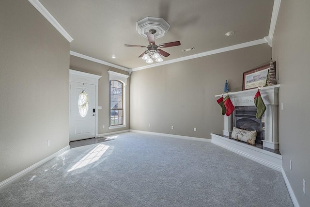 interior space with carpet, ceiling fan, and crown molding