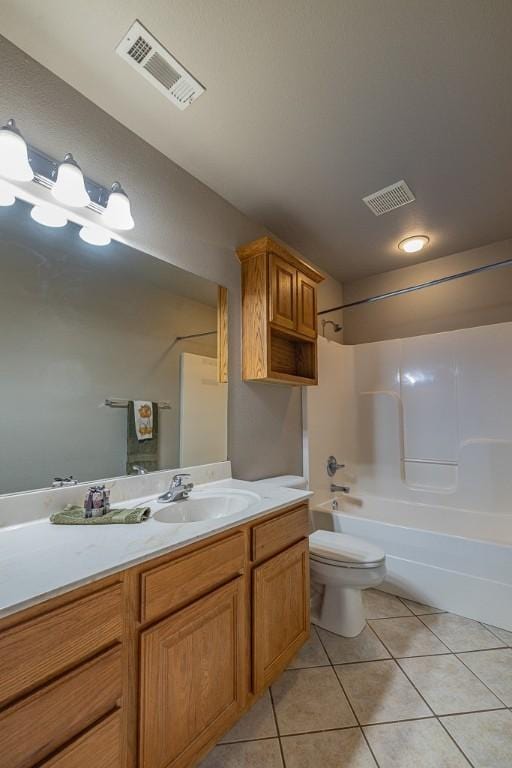 full bathroom with toilet, vanity, tile patterned floors, and shower / bathtub combination