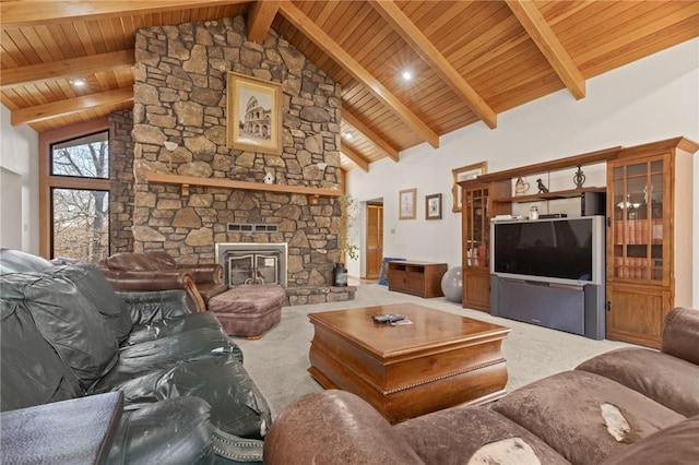 carpeted living room with beam ceiling, a stone fireplace, high vaulted ceiling, and wooden ceiling