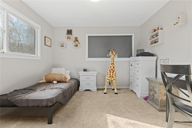 bedroom featuring light carpet