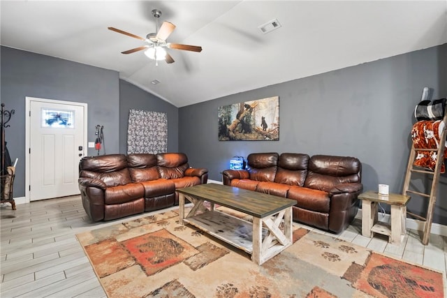 living room with ceiling fan, light hardwood / wood-style floors, and lofted ceiling