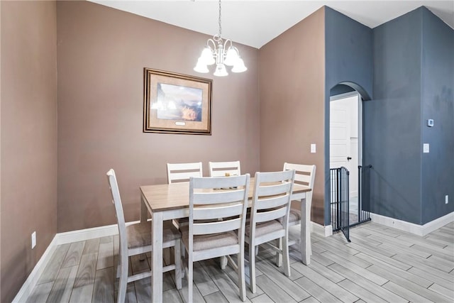 dining room featuring light hardwood / wood-style floors and an inviting chandelier