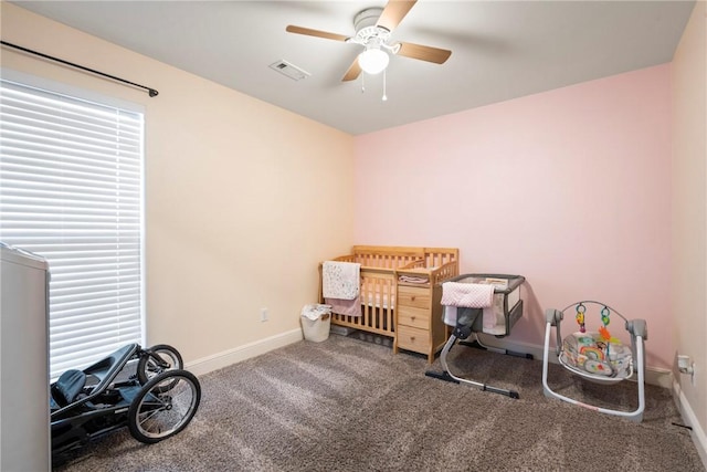 misc room featuring carpet flooring and ceiling fan