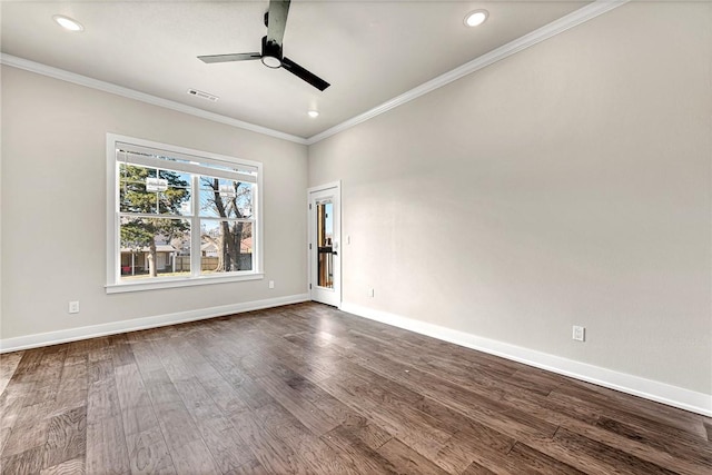 empty room featuring hardwood / wood-style flooring, ceiling fan, and ornamental molding