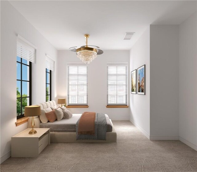 bedroom with light colored carpet and a chandelier