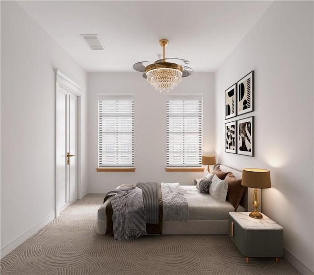 carpeted bedroom featuring a notable chandelier