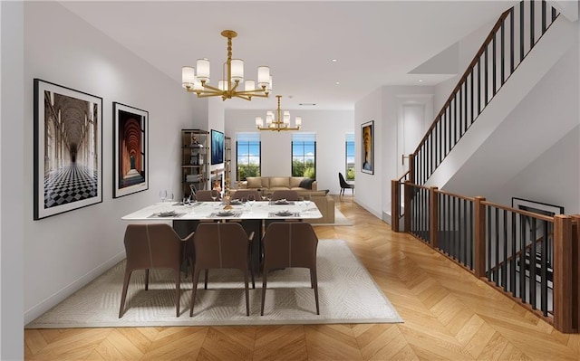 dining space featuring light parquet floors and a notable chandelier