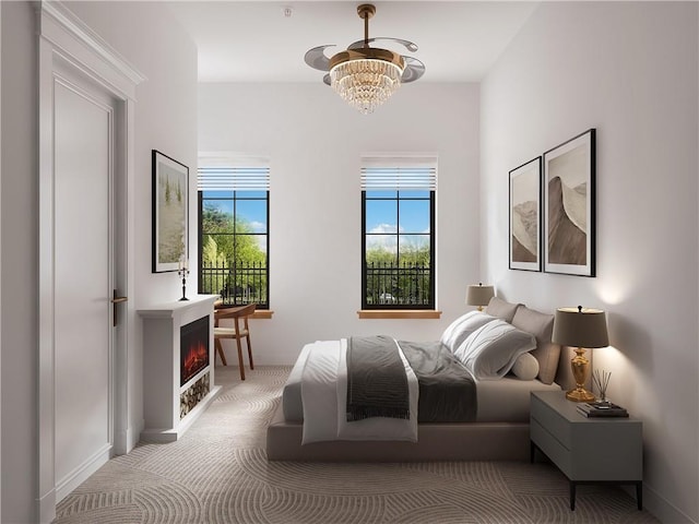 carpeted bedroom featuring a chandelier