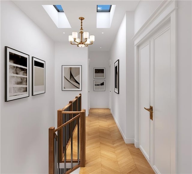 hallway with parquet floors and a notable chandelier