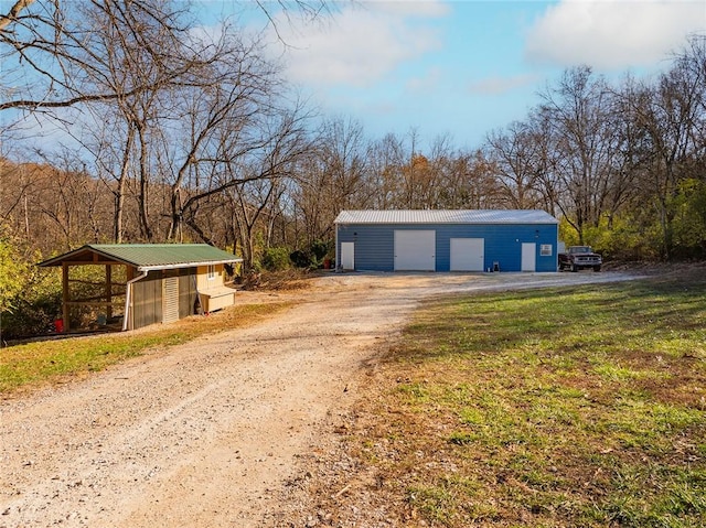 garage featuring a lawn