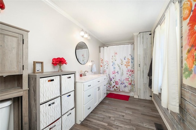 full bathroom with shower / tub combo, vanity, crown molding, hardwood / wood-style floors, and toilet