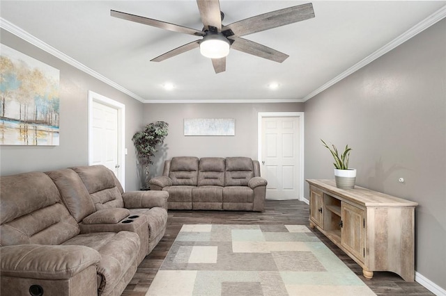 living room with hardwood / wood-style flooring, ceiling fan, and crown molding