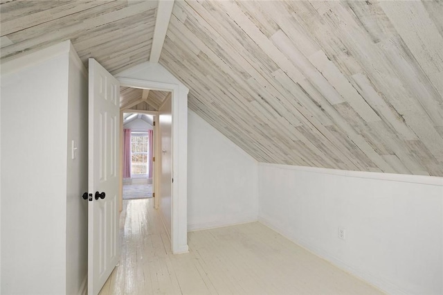 additional living space featuring light wood-type flooring, lofted ceiling, and wood ceiling