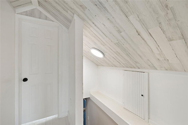 additional living space featuring vaulted ceiling and wooden ceiling