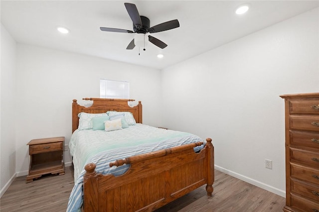 bedroom featuring ceiling fan and hardwood / wood-style floors