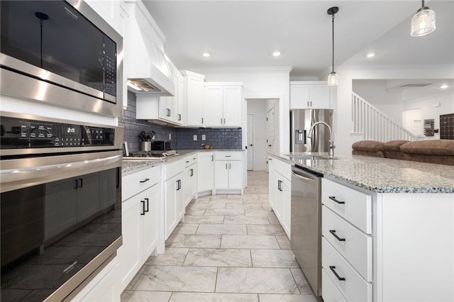 308 S Emerald Woods Run, Farmington, AR 72730 - kitchen with appliances with stainless steel finishes, premium range hood, ornamental molding, light marble finish flooring, and tasteful backsplash