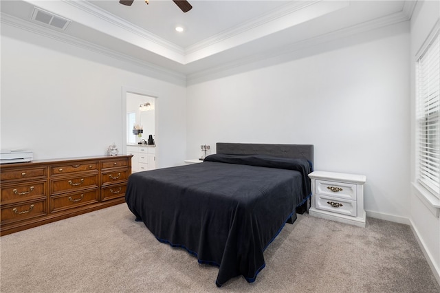 carpeted bedroom featuring a raised ceiling, ceiling fan, and ornamental molding