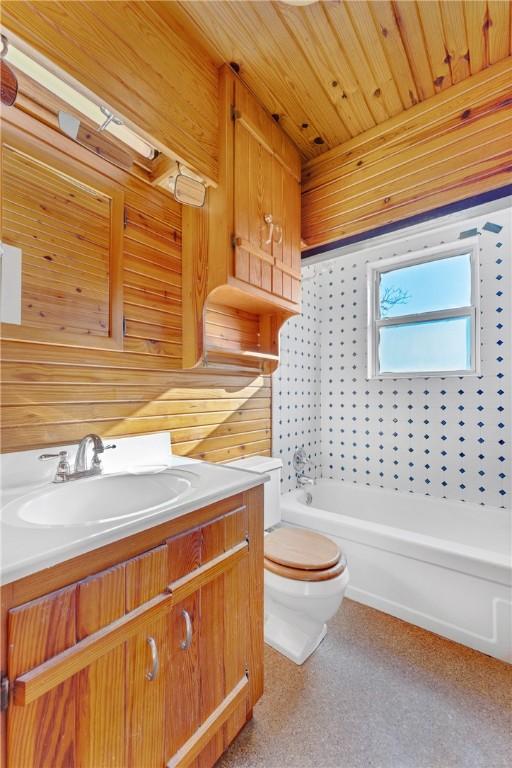 full bathroom featuring vanity, wood walls, toilet, independent shower and bath, and wood ceiling