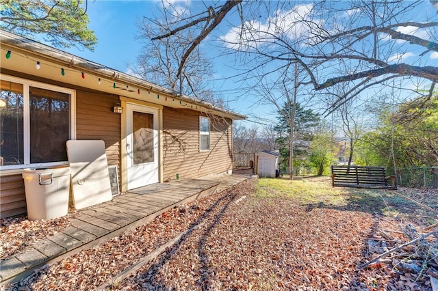 view of home's exterior with a storage shed