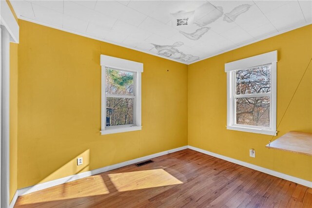 empty room featuring hardwood / wood-style floors