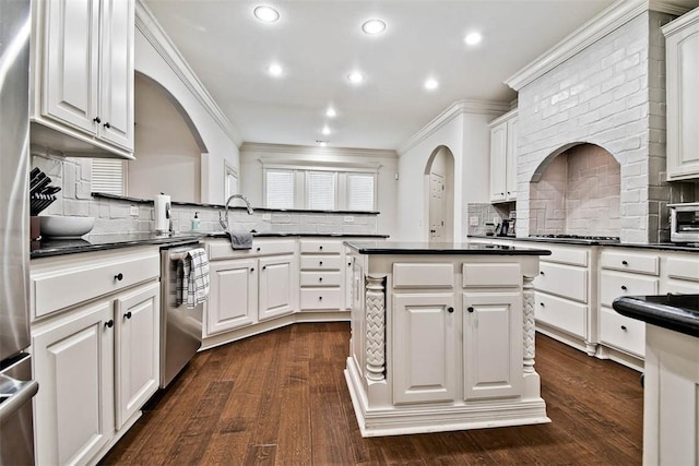 kitchen featuring white cabinets, dishwasher, a kitchen island, and dark hardwood / wood-style flooring