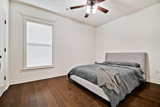 bedroom with ceiling fan and dark hardwood / wood-style flooring