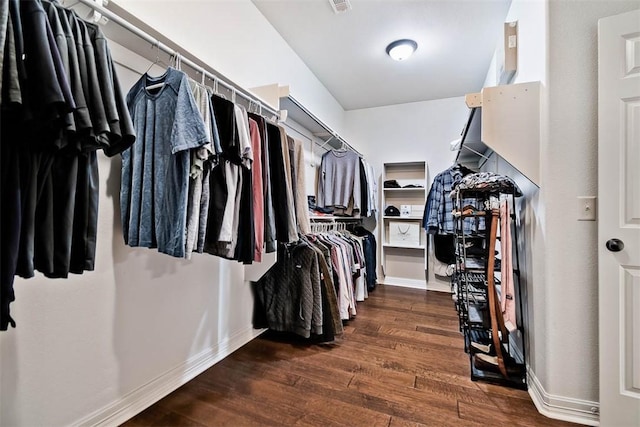 walk in closet featuring dark hardwood / wood-style floors