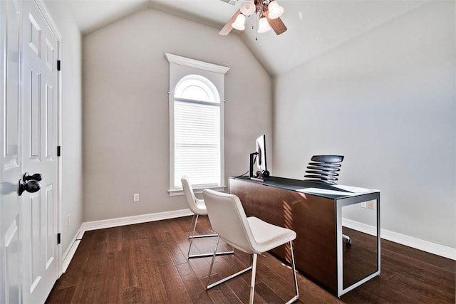 home office with ceiling fan, a healthy amount of sunlight, dark hardwood / wood-style flooring, and vaulted ceiling