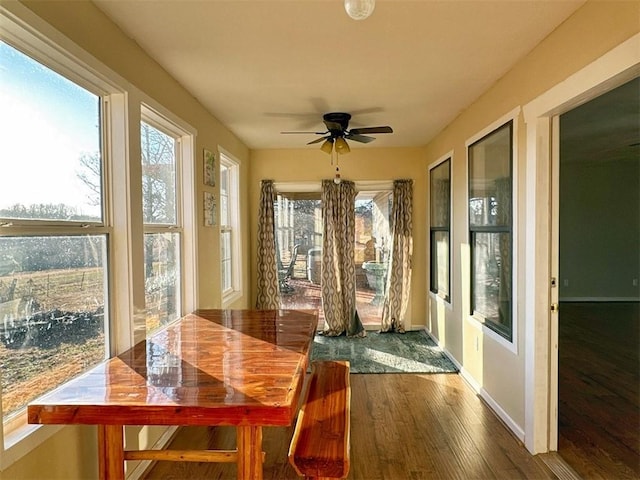 sunroom / solarium featuring ceiling fan and a healthy amount of sunlight