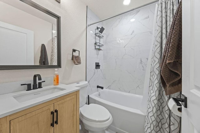 full bathroom featuring vanity, toilet, and shower / tub combo