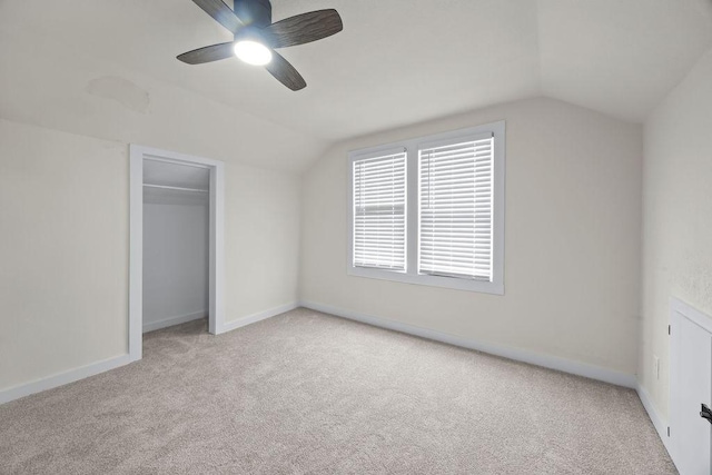 bonus room featuring ceiling fan, light colored carpet, and lofted ceiling