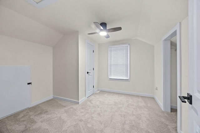 bonus room featuring light carpet, ceiling fan, and lofted ceiling