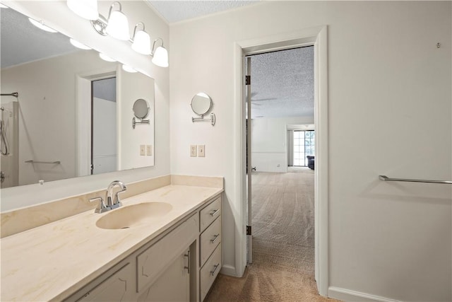 bathroom featuring vanity and a textured ceiling