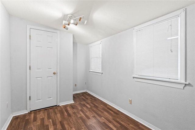 spare room with dark hardwood / wood-style floors