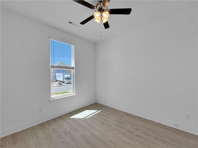 spare room with ceiling fan and light hardwood / wood-style flooring