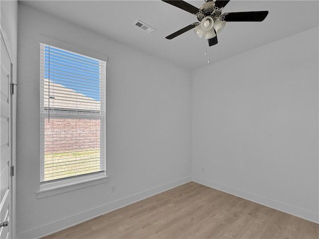 empty room featuring light hardwood / wood-style flooring and ceiling fan