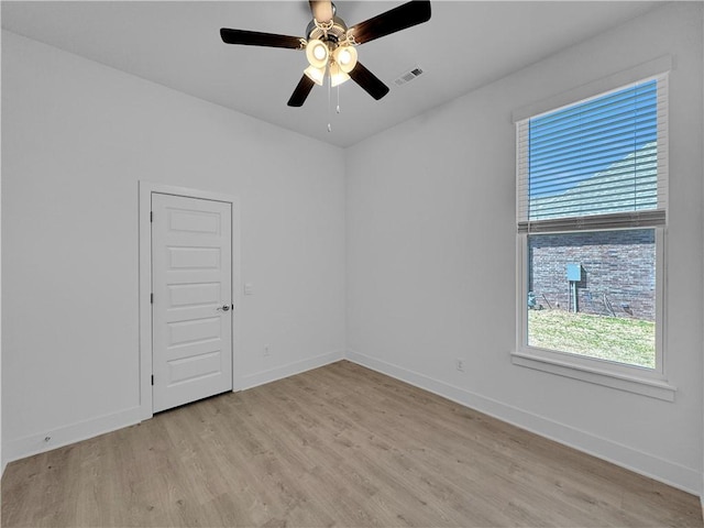 unfurnished room featuring ceiling fan and light wood-type flooring