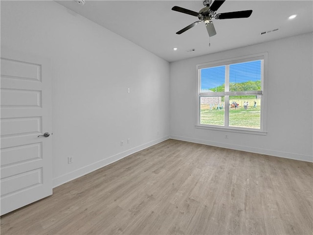 unfurnished room with ceiling fan and light wood-type flooring