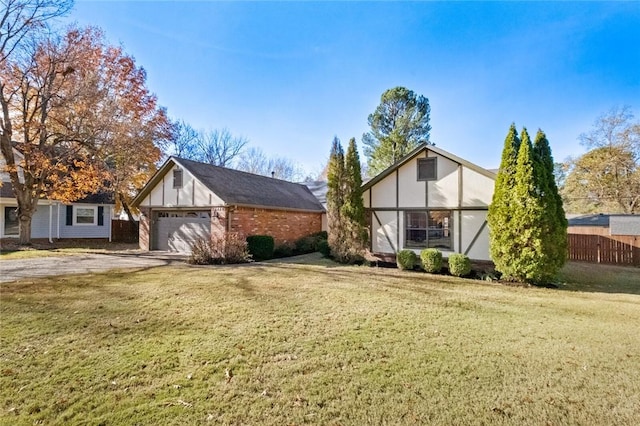 exterior space with a garage and a front lawn