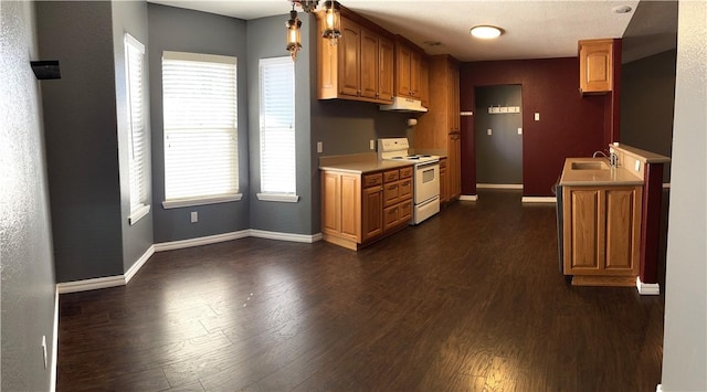 kitchen featuring sink, dark hardwood / wood-style floors, and white electric range